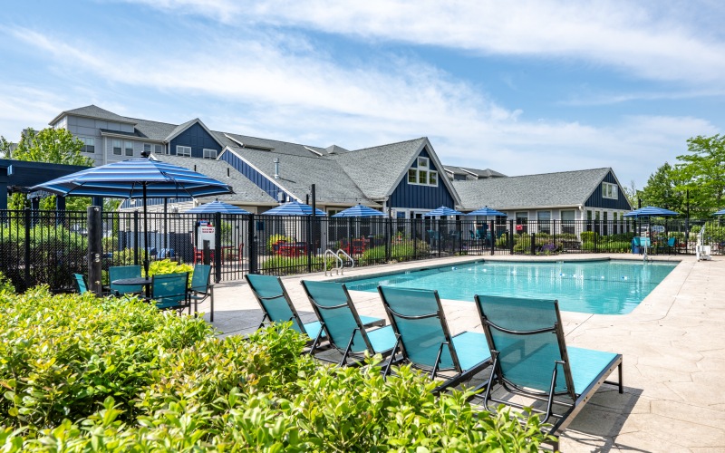 Pool with lounge chairs and umbrellas