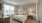 a bedroom with a bed and lamps